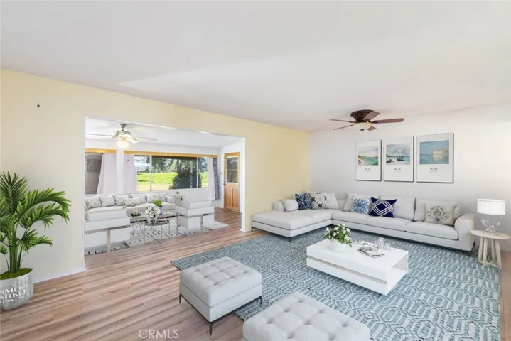 The living room is virtually staged.