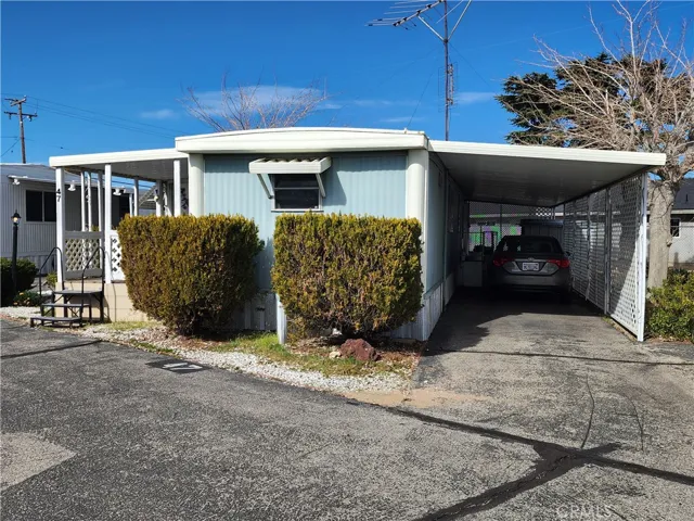 Front With 2 Car Carport