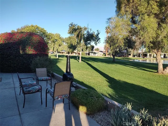 side patio on fairway with fire pit