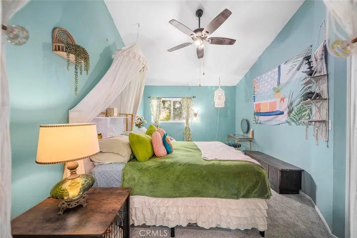 Huge primary bedroom with vaulted ceilings and tons of natural light