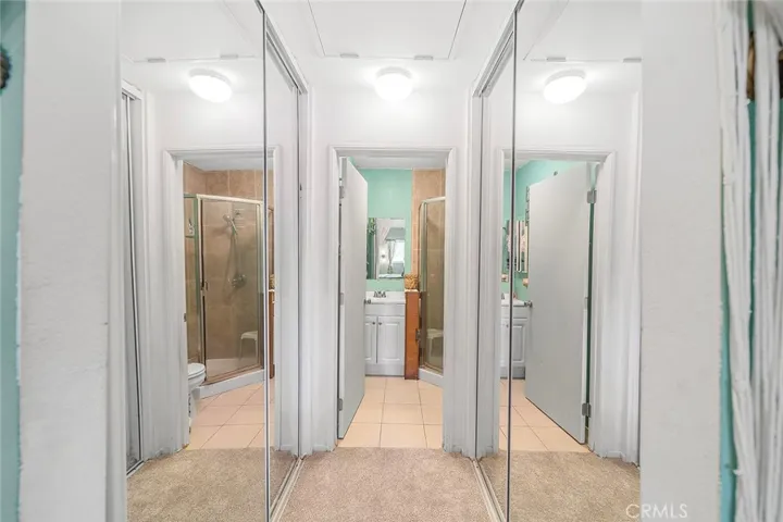 Double mirrored wardrobe closets in primary suite