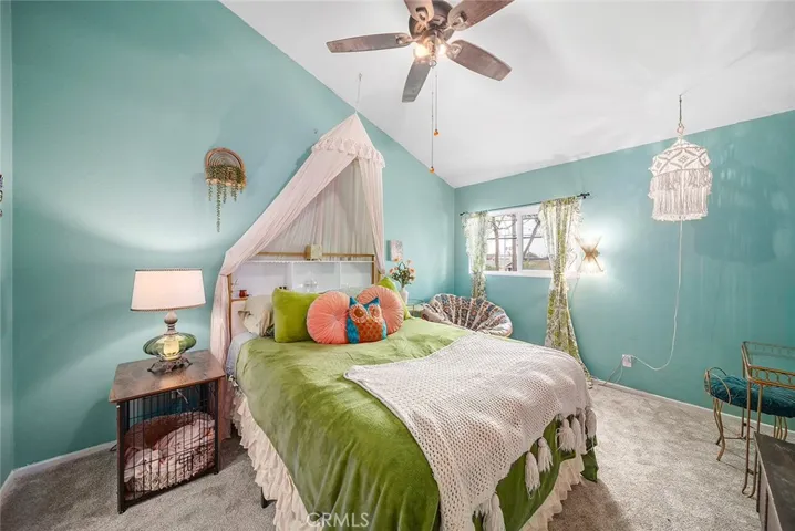 Huge primary bedroom with vaulted ceilings and tons of natural light