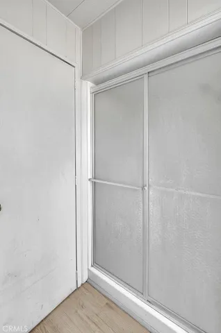 Shower with linen closet