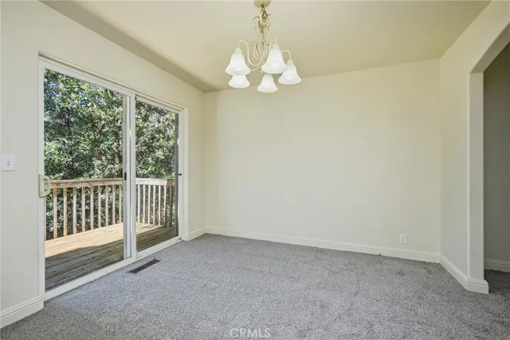 Formal Dining room with a deck out sliding doors