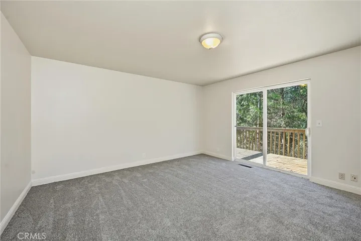 Den/playroom/hobbie room on third level with deck outside