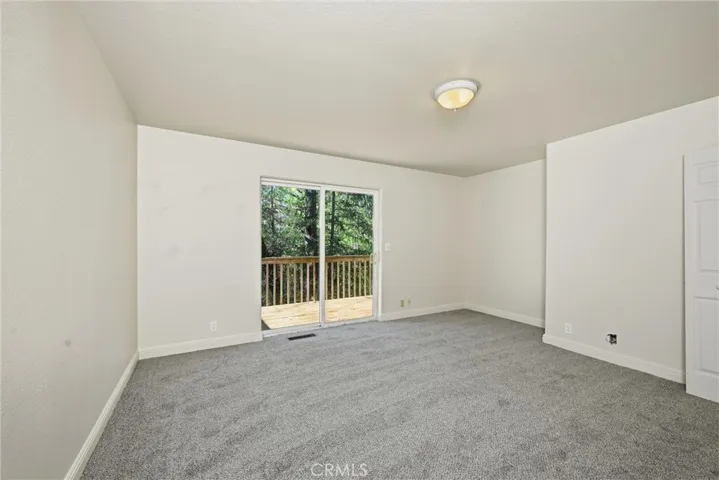 Den/playroom/hobbie room on third level with deck outside