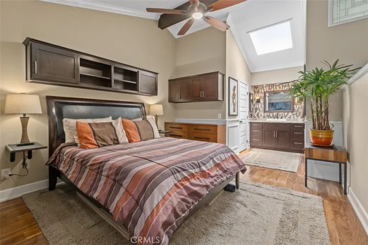 Primary bedroom suite with vaulted ceilings and skylight. 
Photos from pre-tenant occupancy (2023)