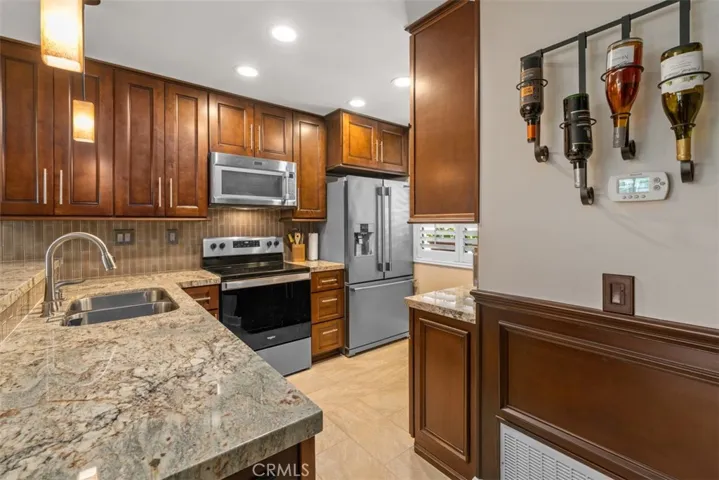 Wainscotting matches the cabinets for an elevated look. 
Photos from pre-tenant occupancy (2023)