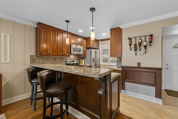 Breakfast bar counter with pendant lighting. 
Photos from pre-tenant occupancy (2023)