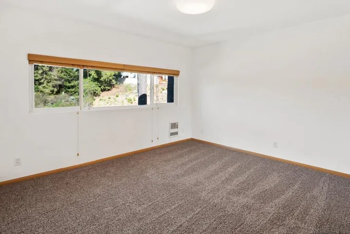 Bedroom has cedar lined mirrored closets.