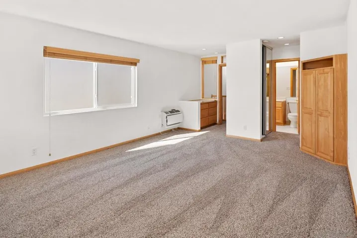 Has two large cedar lined closets with mirrored doors.