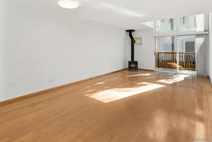Solid maple wood flooring. Only unit with a fireplace.