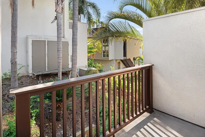 Balcony has room for chairs and table.