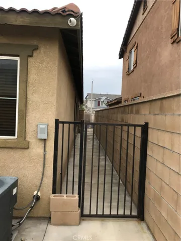 Iron-fenced Side yard.