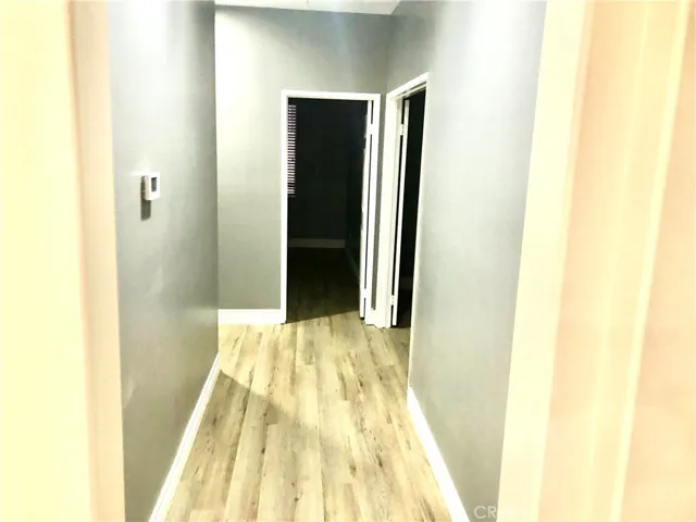 Custom-painted Hallway with white moulding, and designer custom flooring