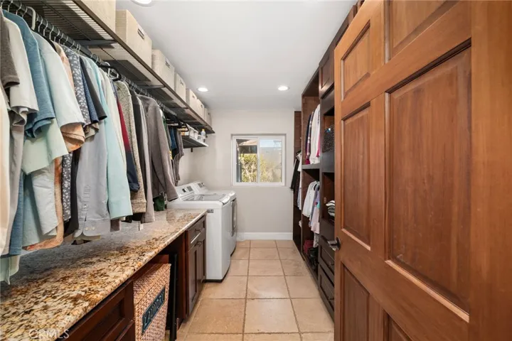 Primary Suite Closet with private laundry!