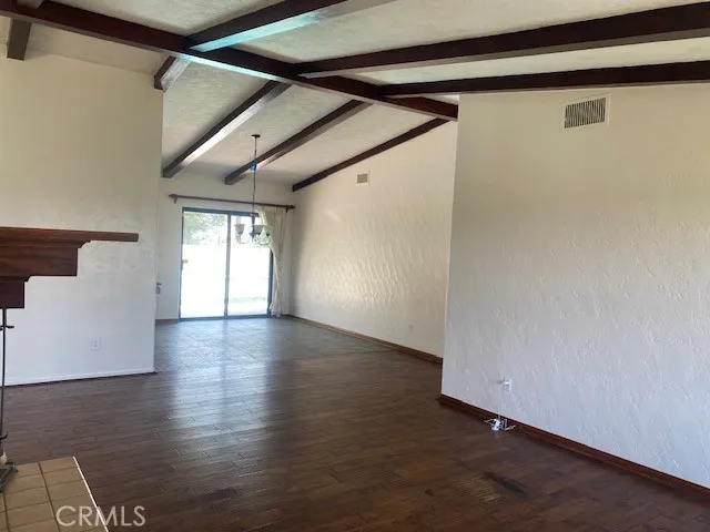 photo looking toward dining area off kitchen and access to pool area