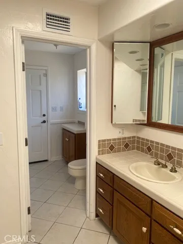 photo of master bath area, water closet & access to pool area