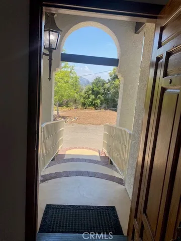 view looking out front door to entry steps