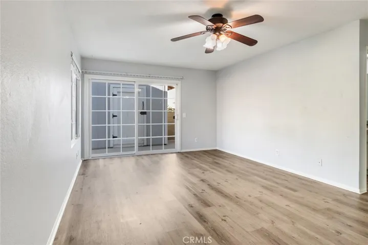 Primary bedroom with attached bath and access to the side yard.