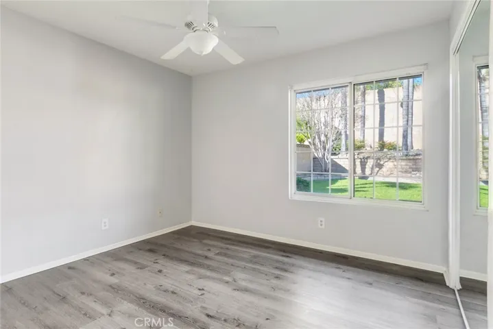 Bedroom #2 features a beautiful window looking out in to the backyard as well as mirrored closet doors.