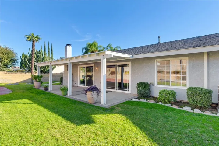 The backyard is an entertainer's dream featuring a covered patio with sports court and plenty of space for BBQs and parties.