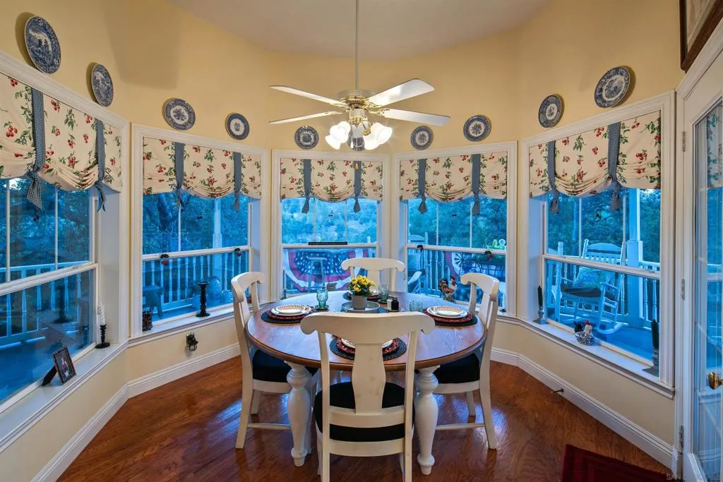 Breakfast area tucked into the turret in the kitchen. Direct access to the wrap around deck to enjoy a cup of coffee on a beautiful morning.
