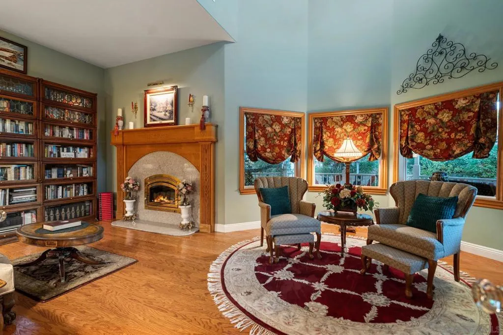 Cozy den with gas fireplace. Located in the front turret.