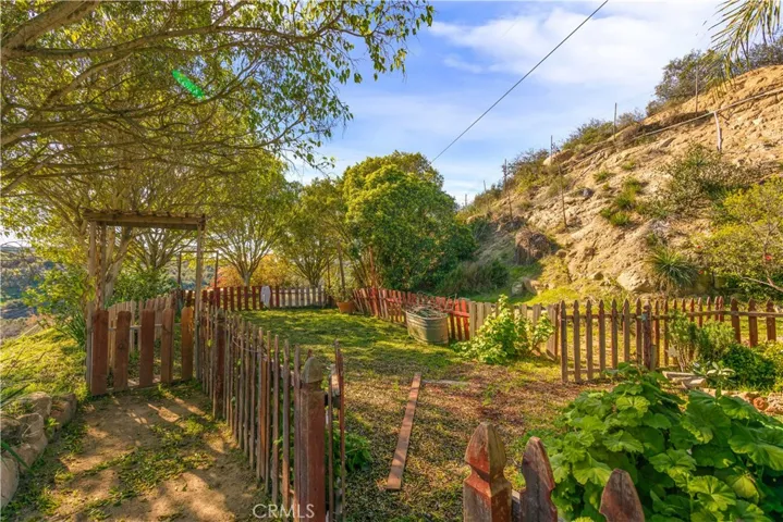 This is a partially fenced backyard area.