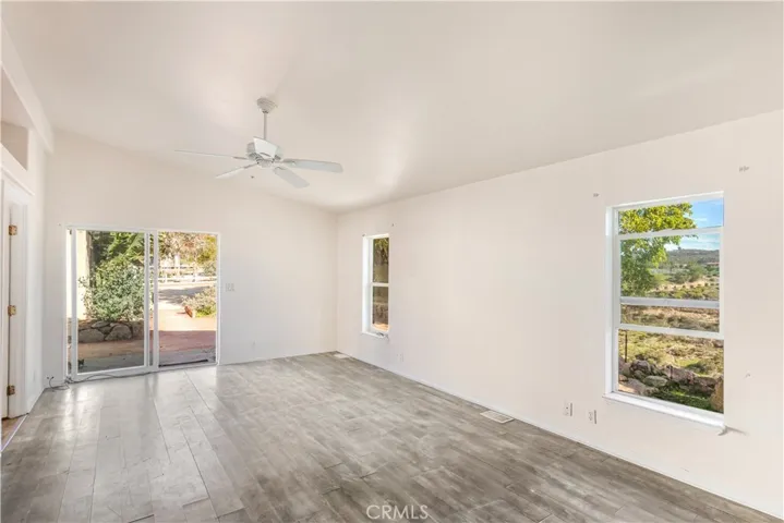 Primary bedroom is oversized and has a sliding door out to the gardens.