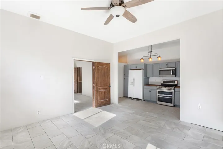 Casita with kitchen in the background and bedroom through the door.