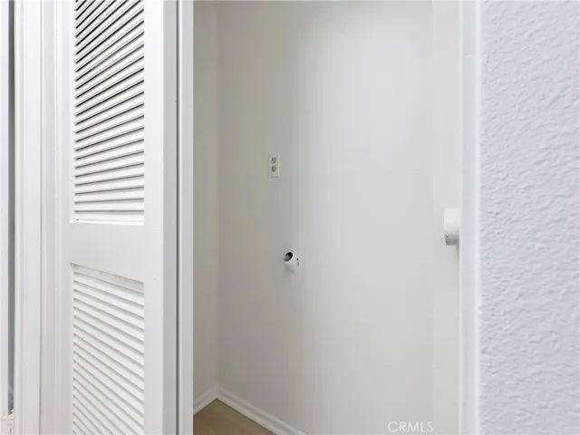Indoor laundry with washer and dryer hookup.
