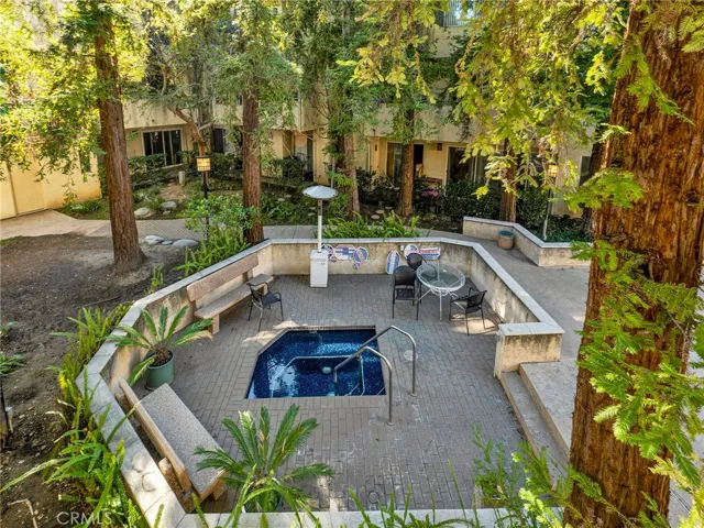 Enjoy the bubbly community spa under mature trees!