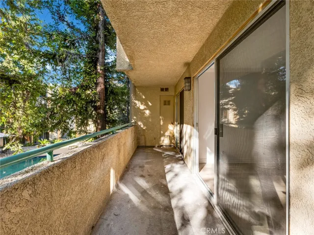 Full length balcony with views of the pool for your enjoyment.