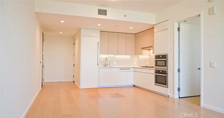 Virtually staged edited open concept w/ no furniture.