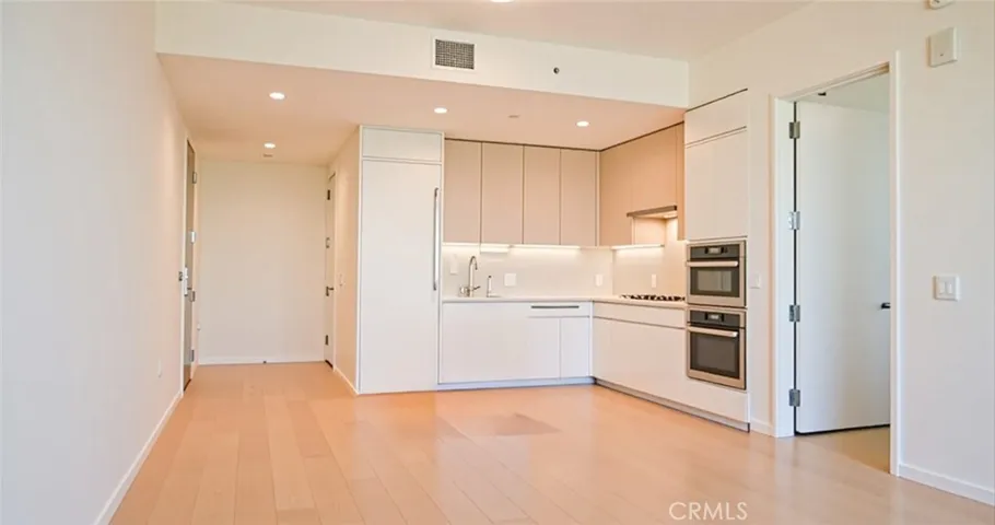 Virtually staged edited open concept w/ no furniture.