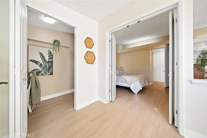 View from sunroom into bedroom and office area