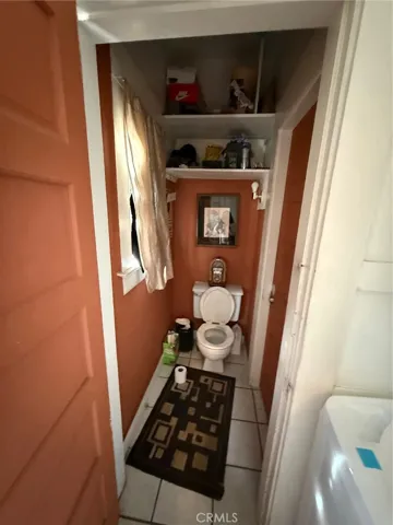 Halfbath at rear of home off laundryroom area