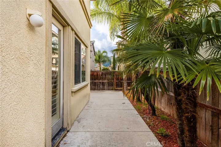 Sidewalk path to backyard
