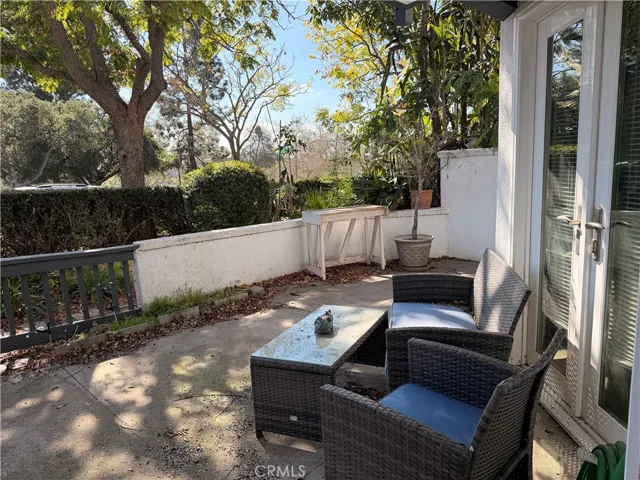 Large patio with doors from living room and primary bedroom, located directly across from RSM lake.