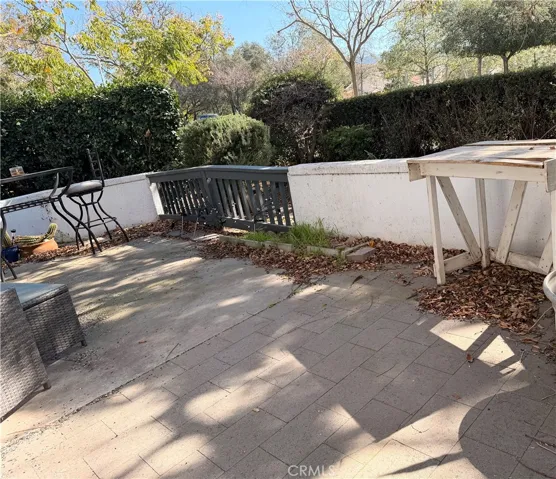 Large patio with doors from living room and primary bedroom, located directly across from RSM lake.
