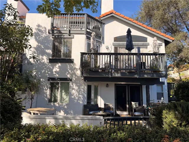 Large patio with doors from living room and primary bedroom, located directly across from RSM lake.