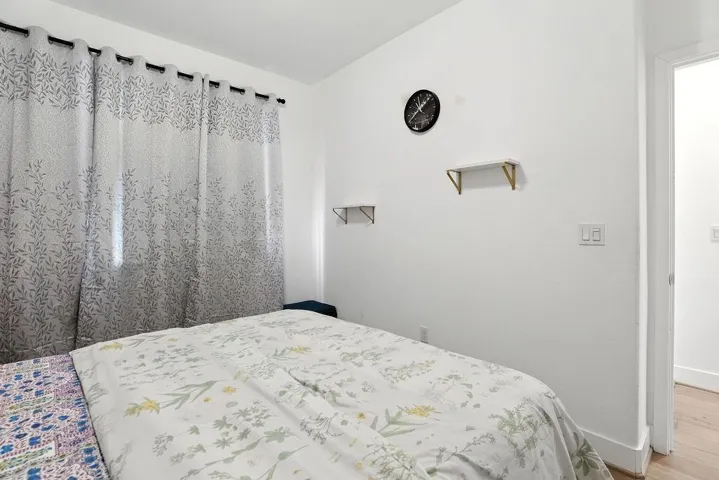 Bedroom with wood finished floors