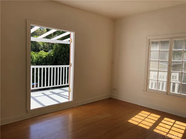 Primary bedroom looking out to balcony