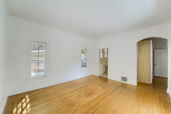 Primary bedroom looking to bathroom
