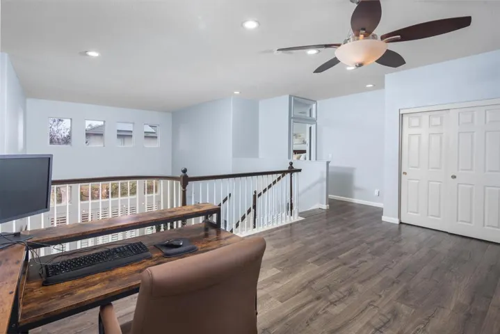 Home office featuring dark wood-style floors, a ceiling fan, and recessed lighting