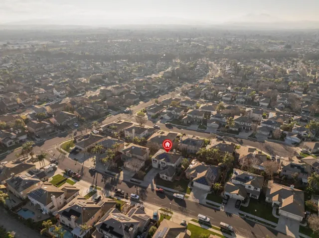 Aerial overview of property's location featuring nearby suburban area