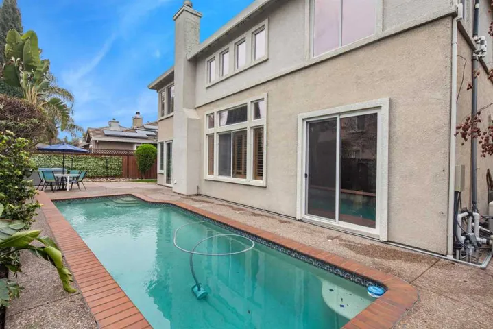 View of pool featuring a patio area and outdoor dining area