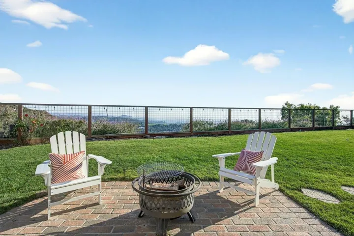 View of patio featuring an outdoor fire pit