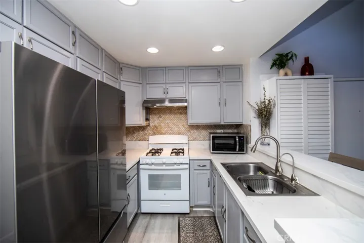 Reses lighting and newer appliances and cabinets